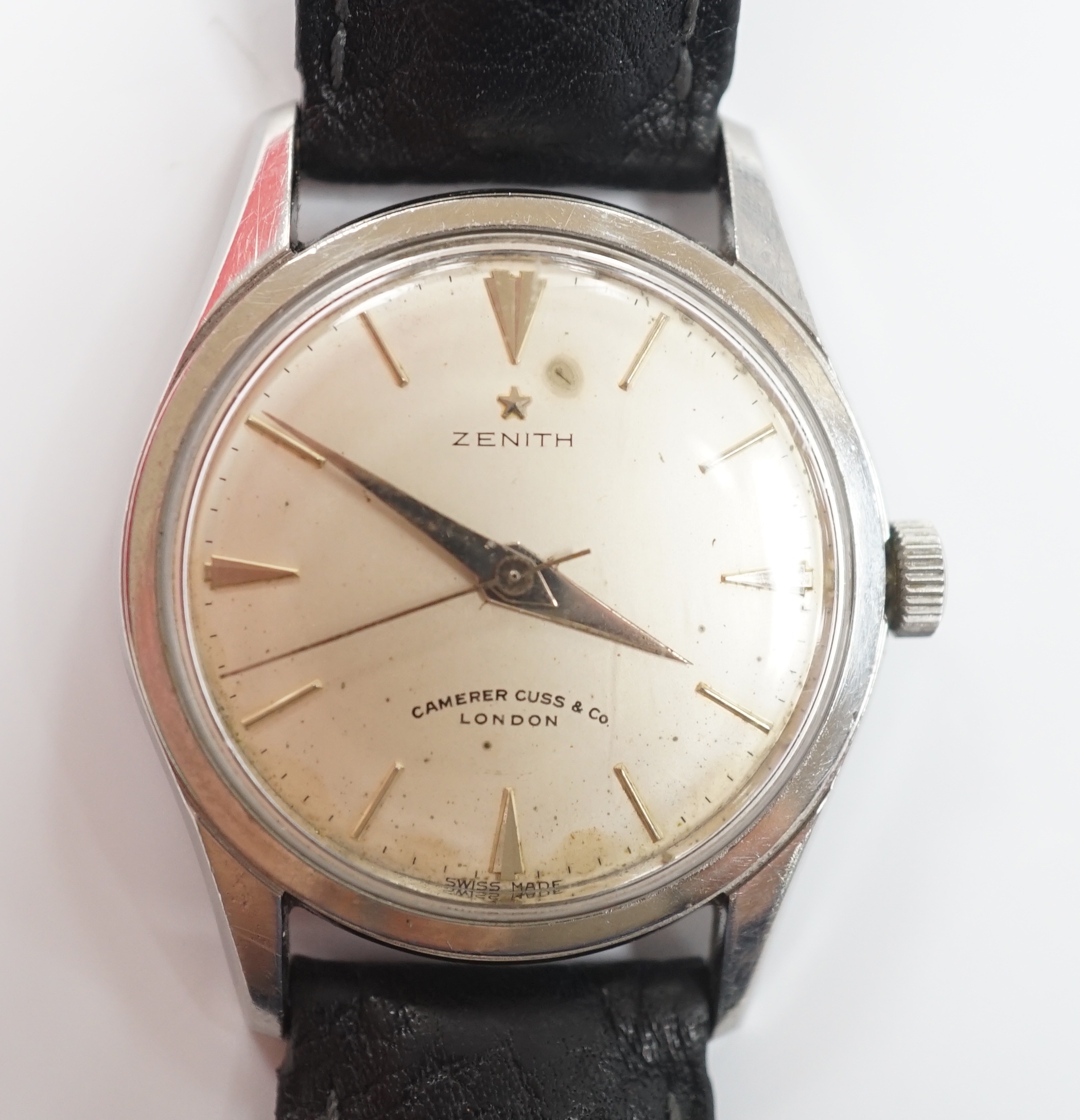 A gentleman's stainless steel Zenith manual wind wrist watch, retailed by Camerer Cuss & Co, London, on associated leather strap.